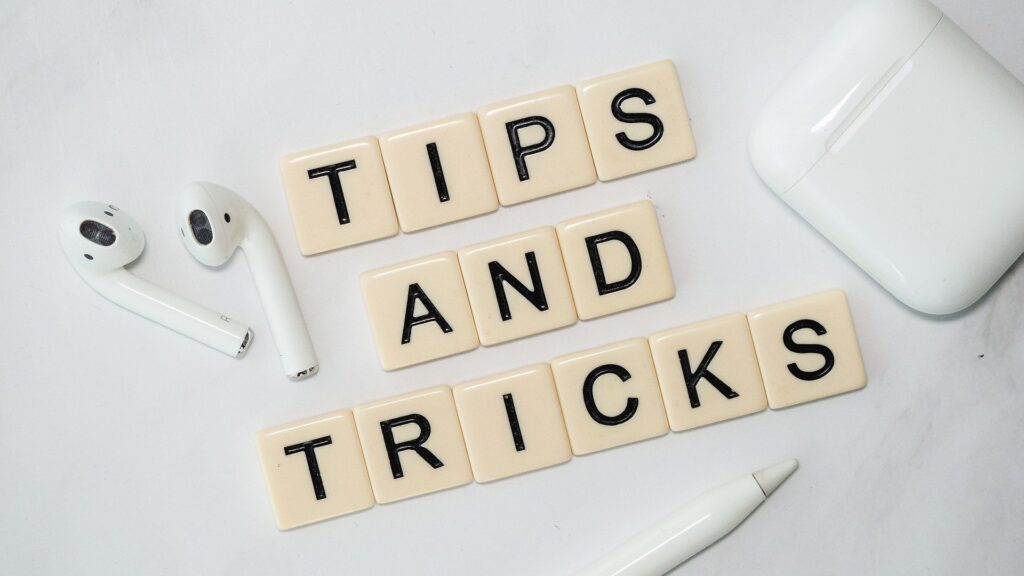 A scrabble board with the words tips and tricks spelt out. alongside the words are a pair of apple headphones. It’s important to have handy tips and trick at your disposal to stop mistakes happening when publishing posts to LinkedIn.